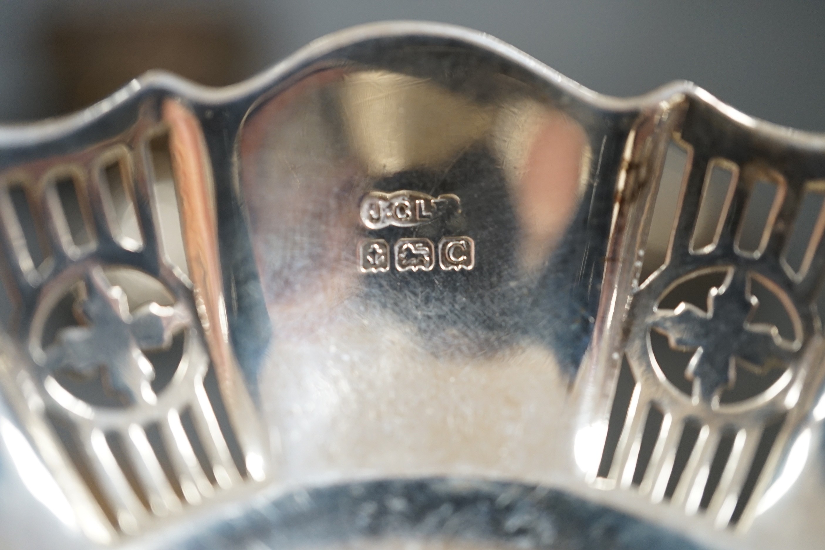 A late 19th/early 20th century repousse silver rose bowl, marks rubbed, diameter 12.6cm and two pairs of silver bonbon dishes.